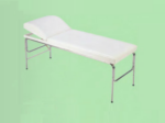 Examination bed with headrest